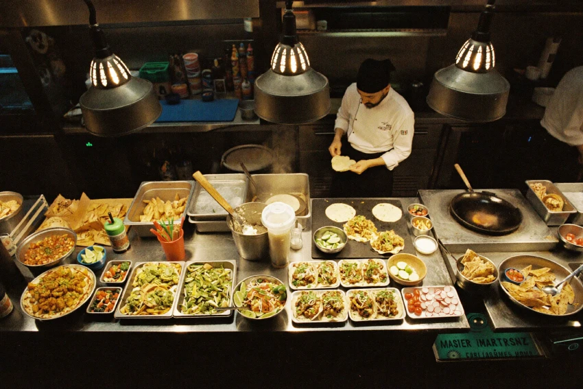 High-volume Mexican foodservice kitchen preparing tortillas and tacos during active service