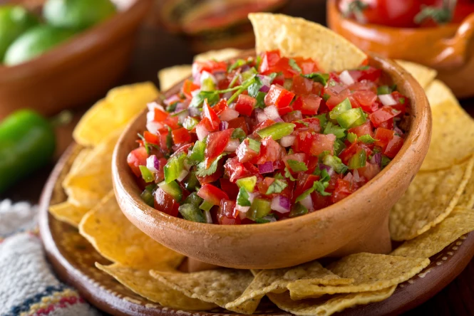 Mexican snacks served with fresh salsa and tortilla chips