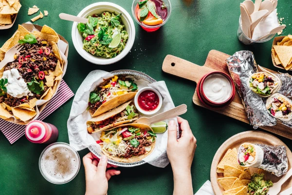 Mexican-inspired dishes demonstrating versatile sauce and condiment applications across multiple menu items